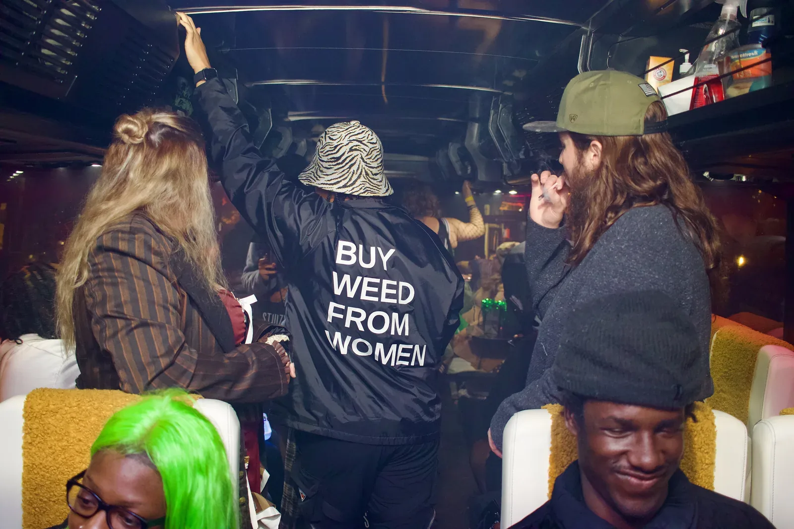 A SESH rep wearing a 'Buy Weed From Women' jacket